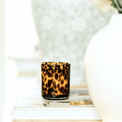 Stylized photo of Leopard candle vessel by The First Burn Candle Co
