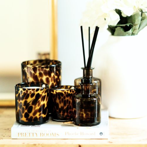 Stylized photo of Leopard vessels by The First Burn Candle Co