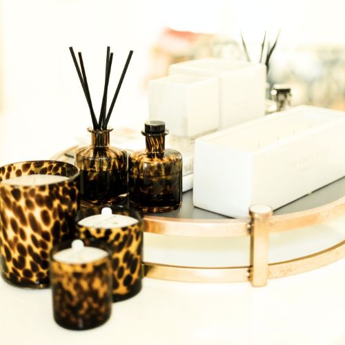 Stylized photo of Leopard and Ceramic vessels by The First Burn Candle Co